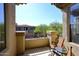 Balcony with outdoor seating and a view of neighborhood greenery at 16420 N Thompson Peak Pkwy # 2020, Scottsdale, AZ 85260