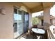 Cozy balcony with outdoor seating, perfect for relaxing and enjoying the view in a private setting at 16420 N Thompson Peak Pkwy # 2020, Scottsdale, AZ 85260