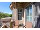 Balcony with outdoor seating and shutters for privacy and shade at 16420 N Thompson Peak Pkwy # 2020, Scottsdale, AZ 85260