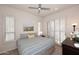 Bedroom featuring a coordinated palette, window shutters, and a tranquil ambiance for a relaxing retreat at 16420 N Thompson Peak Pkwy # 2020, Scottsdale, AZ 85260