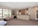 Spacious common area with a kitchenette, large windows and comfortable seating at 16420 N Thompson Peak Pkwy # 2020, Scottsdale, AZ 85260
