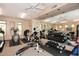Well-equipped gym featuring cardio machines, weights, mirrors and ceiling fans at 16420 N Thompson Peak Pkwy # 2020, Scottsdale, AZ 85260