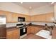 Well-equipped kitchen with plenty of counter space and wooden cabinets at 16420 N Thompson Peak Pkwy # 2020, Scottsdale, AZ 85260
