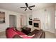 Cozy living room with a fireplace, entertainment center, and comfortable seating at 16420 N Thompson Peak Pkwy # 2020, Scottsdale, AZ 85260