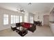 Bright living room with a ceiling fan, comfortable seating, and natural light at 16420 N Thompson Peak Pkwy # 2020, Scottsdale, AZ 85260