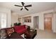 Bright living room with a ceiling fan, open layout, and comfortable seating at 16420 N Thompson Peak Pkwy # 2020, Scottsdale, AZ 85260
