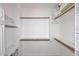 Organized walk-in closet with built-in shelving and rods, offering ample storage solutions for an efficient lifestyle at 16420 N Thompson Peak Pkwy # 2020, Scottsdale, AZ 85260