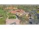 Aerial shot of clubhouse with red tile roof, golf course, and palm tree landscaping at 16946 W Vernon Ave, Goodyear, AZ 85395