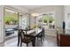 Bright dining area with access to the outdoor patio through sliding glass doors at 16946 W Vernon Ave, Goodyear, AZ 85395