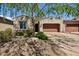 Charming home featuring a desert landscaped yard, covered entry, and two-car garage at 16946 W Vernon Ave, Goodyear, AZ 85395