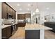 Spacious kitchen featuring a large center island, granite counters, and stainless steel appliances at 16946 W Vernon Ave, Goodyear, AZ 85395