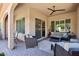 Covered patio featuring stylish furniture and comfortable seating, perfect for relaxing outdoors at 16946 W Vernon Ave, Goodyear, AZ 85395