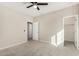 Bright bedroom features plush carpeting and a closet for storage at 17736 W Cassia Way, Goodyear, AZ 85338