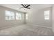Bright, spacious bedroom with ample windows and neutral carpet flooring at 17736 W Cassia Way, Goodyear, AZ 85338