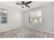 Well-lit bedroom featuring neutral paint and plush carpet at 17736 W Cassia Way, Goodyear, AZ 85338
