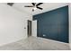 Stylish bedroom featuring blue accent wall and plush carpeting at 17736 W Cassia Way, Goodyear, AZ 85338
