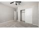 Bedroom features neutral paint, plush carpeting, and closet at 17736 W Cassia Way, Goodyear, AZ 85338