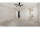 Large bedroom features a ceiling fan and access to an en-suite bathroom at 17736 W Cassia Way, Goodyear, AZ 85338