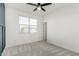 A well lit bedroom featuring neutral paint and plush carpet at 17736 W Cassia Way, Goodyear, AZ 85338