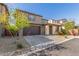 Attractive two-story home featuring a two-car garage and meticulously maintained xeriscape front yard at 17736 W Cassia Way, Goodyear, AZ 85338