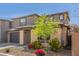 Inviting two-story home with a two-car garage, complemented by colorful and easy-care xeriscape landscaping at 17736 W Cassia Way, Goodyear, AZ 85338