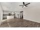 Inviting living area with hardwood floors leading to the open kitchen at 17736 W Cassia Way, Goodyear, AZ 85338