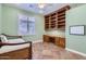 Comfortable bedroom with built-in shelves and a desk, perfect for a home office or study at 17951 W Sammy Way, Surprise, AZ 85374