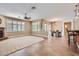 Open concept living room with tile floors, a ceiling fan, and natural light at 17951 W Sammy Way, Surprise, AZ 85374