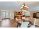 A dining area overlooks the kitchen and living room, with beautiful tile floors at 17951 W Sammy Way, Surprise, AZ 85374