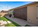 Backyard featuring a covered patio with a retractable screen, artificial turf, and a barbecue area at 18970 W Desert Hills Dr, Surprise, AZ 85388