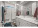 Modern bathroom with a walk-in shower, white vanity, and contemporary finishes at 18970 W Desert Hills Dr, Surprise, AZ 85388