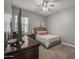 Cozy bedroom with neutral colors, comfortable bed, and stylish furnishings at 18970 W Desert Hills Dr, Surprise, AZ 85388