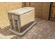 Installed backup generator in a brick-lined outdoor space at 18970 W Desert Hills Dr, Surprise, AZ 85388