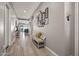 Inviting hallway with wood-look tile floors and stylish decor at 18970 W Desert Hills Dr, Surprise, AZ 85388