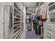 Organized walk-in closet with shelves, hanging racks, and storage solutions at 18970 W Desert Hills Dr, Surprise, AZ 85388