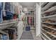 Bright walk-in closet featuring ample storage space for clothes and accessories at 18970 W Desert Hills Dr, Surprise, AZ 85388