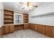 Bedroom featuring built-in bookshelves and cabinets, offering ample storage and display space at 201 S Greenfield Rd # 129, Mesa, AZ 85206