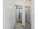 Hallway view of a modern bathroom featuring decorative tile in the glass enclosed shower and sleek design at 20100 N 78Th Pl # 3084, Scottsdale, AZ 85255