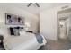 Bright bedroom featuring neutral tones, plush bedding, and an open hallway leading to additional rooms at 20100 N 78Th Pl # 3084, Scottsdale, AZ 85255