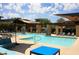 Inviting community pool area with shaded lounge chairs, water features, and well-maintained landscaping, perfect for relaxation at 20100 N 78Th Pl # 3084, Scottsdale, AZ 85255