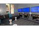 Community game room with multiple TVs, comfortable seating, and recreational amenities for residents at 20100 N 78Th Pl # 3084, Scottsdale, AZ 85255