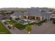 The backyard of the house featuring a pool, lounge area and grassy area, perfect for outdoor entertaining at 20213 W Amelia Ave, Buckeye, AZ 85396