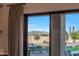 View of the backyard featuring green grass, patio furniture, trees, and mountain views at 20213 W Amelia Ave, Buckeye, AZ 85396