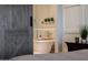 Luxurious bathroom featuring a soaking tub with wood tray, modern fixtures, and neutral décor at 20213 W Amelia Ave, Buckeye, AZ 85396