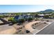 Expansive property showcasing the home's elegant exterior, circular driveway, and desert landscaping at 20213 W Amelia Ave, Buckeye, AZ 85396