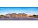 Spacious three car garage with brick-paved driveway complements the stylish exterior of this beautiful home at 20213 W Amelia Ave, Buckeye, AZ 85396