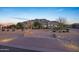 Elegant residence boasting an expansive circular driveway, desert landscaping, and a charming entrance at 20213 W Amelia Ave, Buckeye, AZ 85396