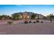 Stunning single-Gathering home featuring well-maintained landscaping and excellent curb appeal at twilight at 20213 W Amelia Ave, Buckeye, AZ 85396