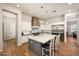 Gourmet kitchen featuring a large island, custom cabinetry, and top-of-the-line stainless steel appliances at 20213 W Amelia Ave, Buckeye, AZ 85396