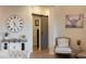 Living room featuring a barn door, hardwood floors, and stylish decorative pieces at 20213 W Amelia Ave, Buckeye, AZ 85396